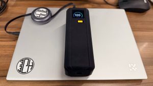 Xiaomi 212W HyperCharge Power Bank 24500 showing 100 percent battery on a laptop